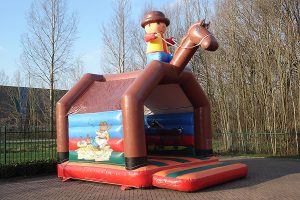 Big bouncy castle Cowboy with roof